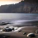 Turquoise Atlantic waters and sandy beach perfect for a beach vacation on Tenerife with blue sky