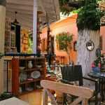 Perfect garden furniture arrangement on a terrace with comfortable seating, dining sets, and outdoor accessories creating an