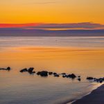 Scenic Baltic Sea coastal landscape featuring sandy beaches, dramatic cliffs, and picturesque seaside villages perfect for a