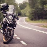 Premium motorcycle windshield protecting rider from wind resistance and improving aerodynamic performance on highway rides