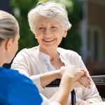 Seniorenbetreuung aus Polen—professional caregiver assisting elderly patient with daily activities