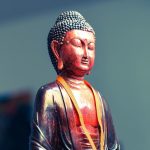 Authentic antique Buddha statue from Asia, handcrafted with traditional iconographic details and fine material quality