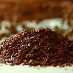 Organic flaxseeds displayed as a nutrient-rich superfood containing omega-3 fatty acids, fiber, and lignans for daily health